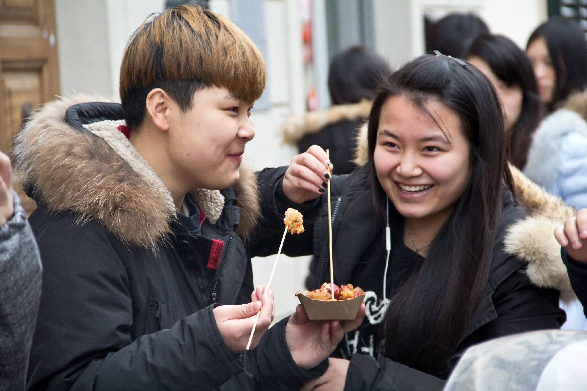 Chinese residents enjoy a snack at the Festa delle Luci celebrations in February 2016. Photo Alessandra Gucci